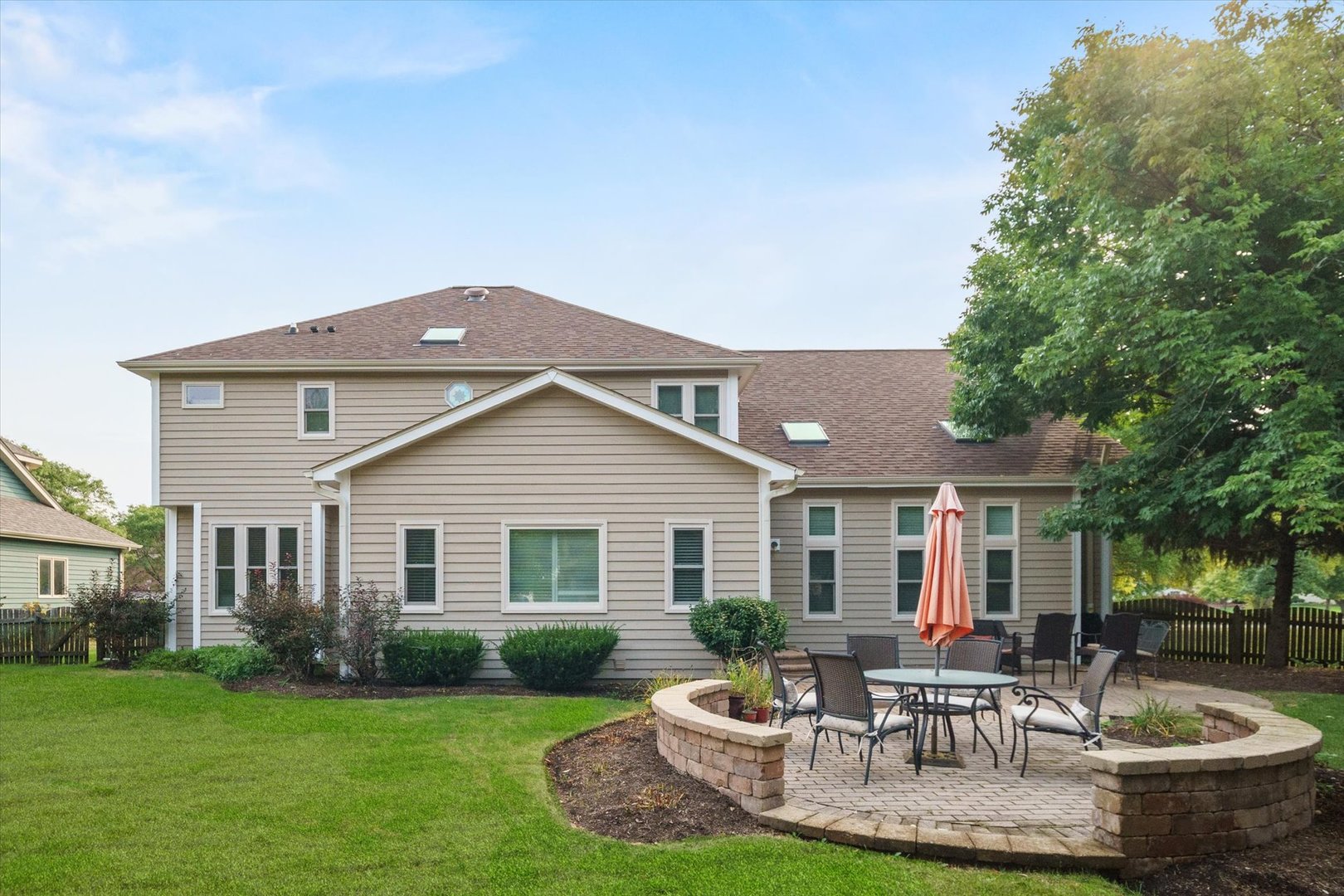 3235 Gateshead Drive Naperville, IL 60564 - Photo 7 of 21 a front view of a house with a yard fire pit and outdoor seating
