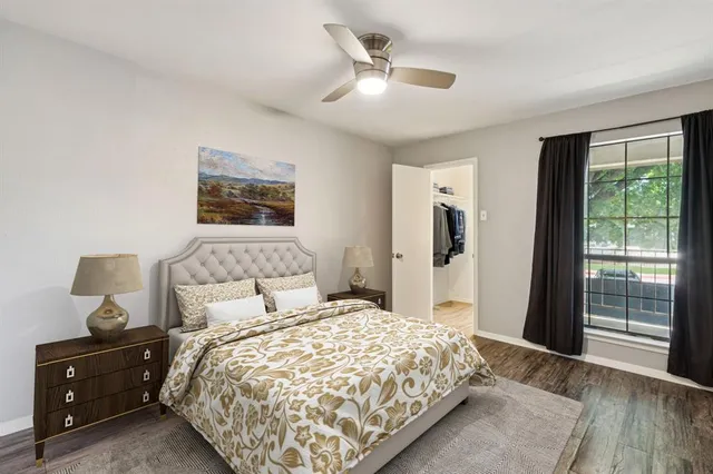 a bedroom with a large bed and a window