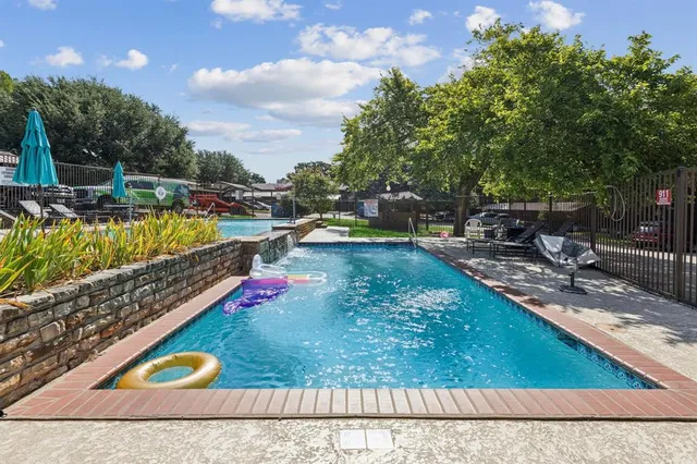 swimming pool with outdoor seating