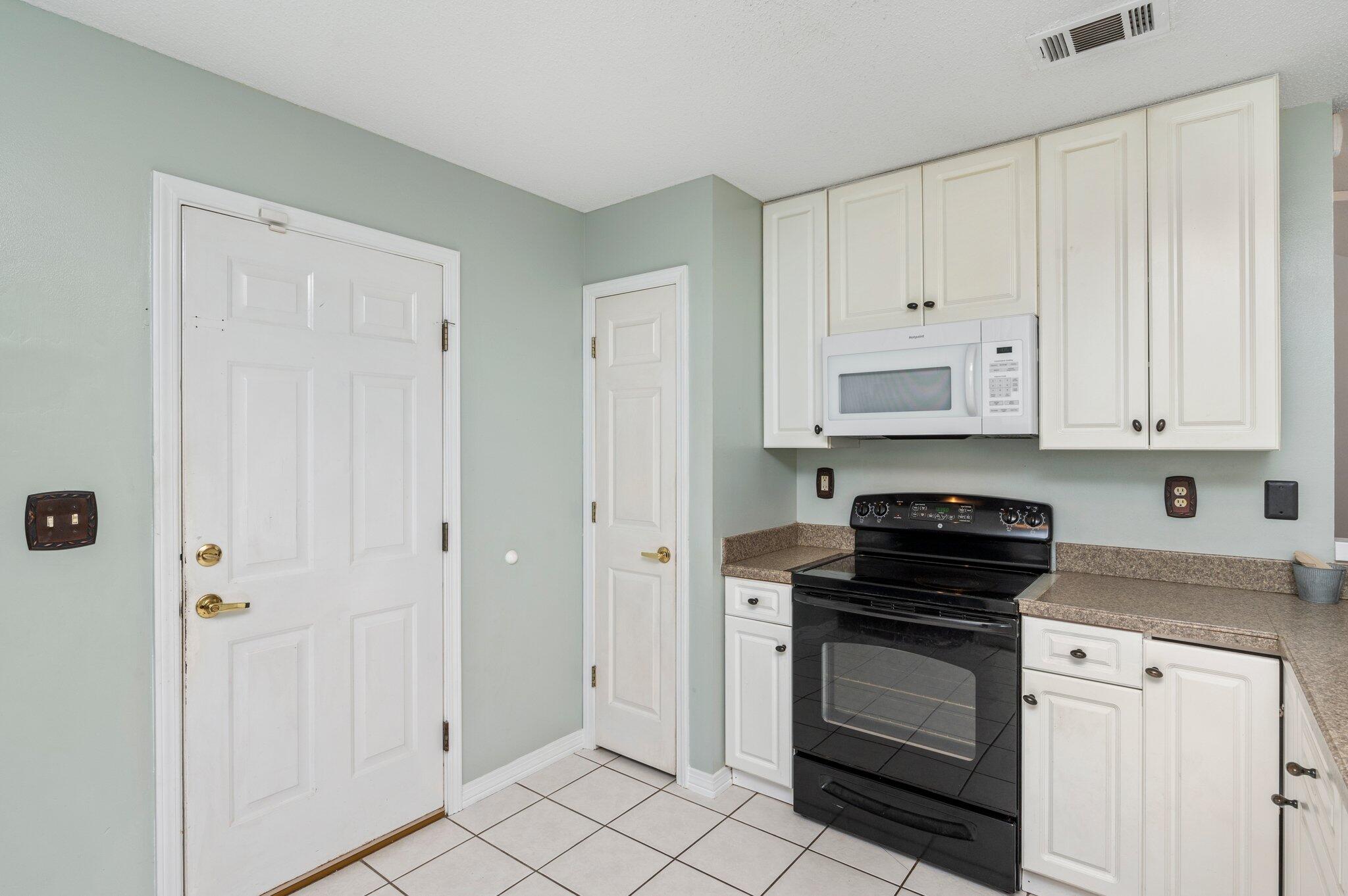 5417 Monterrey Road Crestview, FL 32539 - Photo 17 of 43 Interior Kitchen Exit