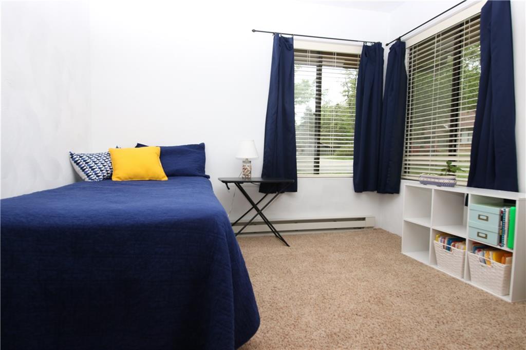 2713 Powder Ridge Road Hidden Valley, PA 15502 - Photo 15 of 30 a bedroom with a bed and lamp