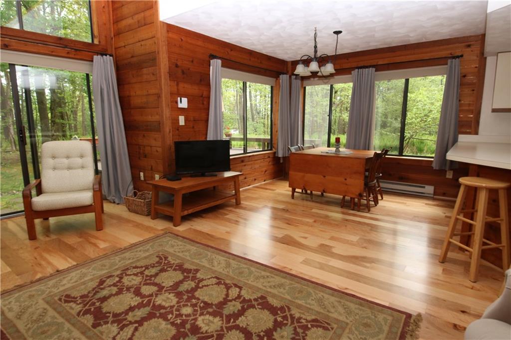 2713 Powder Ridge Road Hidden Valley, PA 15502 - Photo 4 of 30 a living room with furniture fireplace and a large window