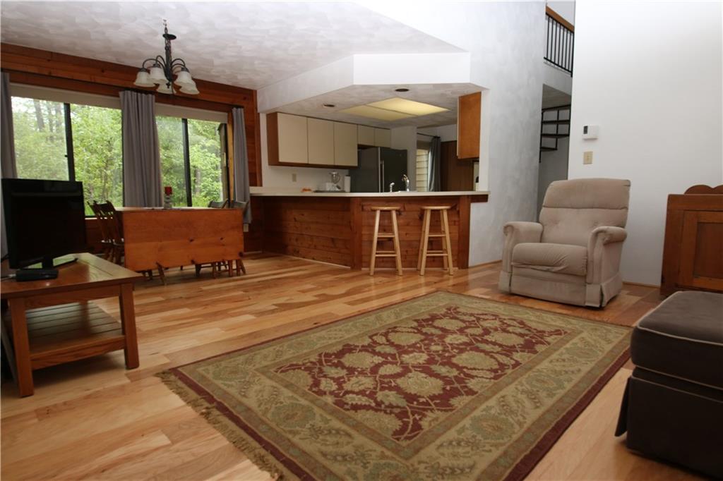 2713 Powder Ridge Road Hidden Valley, PA 15502 - Photo 6 of 30 a living room with furniture rug and a fireplace