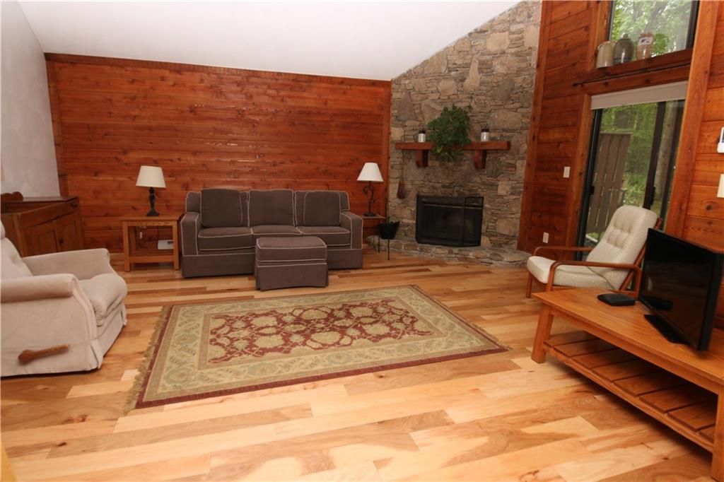 2713 Powder Ridge Road Hidden Valley, PA 15502 - Photo 9 of 30 a living room with furniture and a fireplace