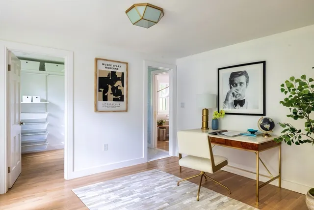 a workspace with furniture and window