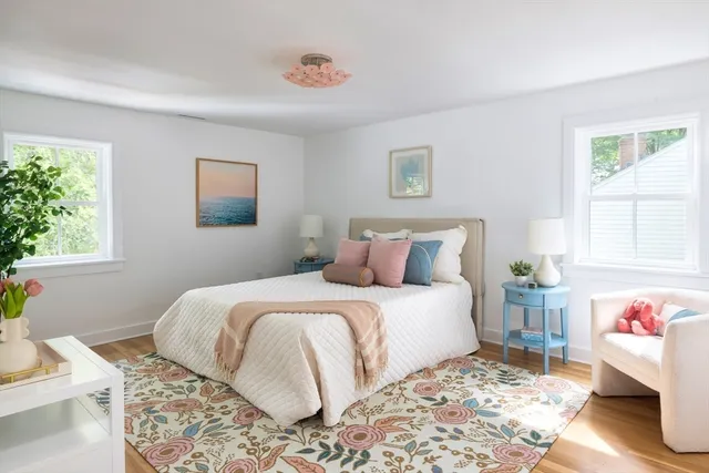 a bedroom with a large bed and a window