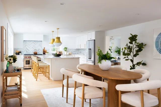 a kitchen with a table and chairs in it