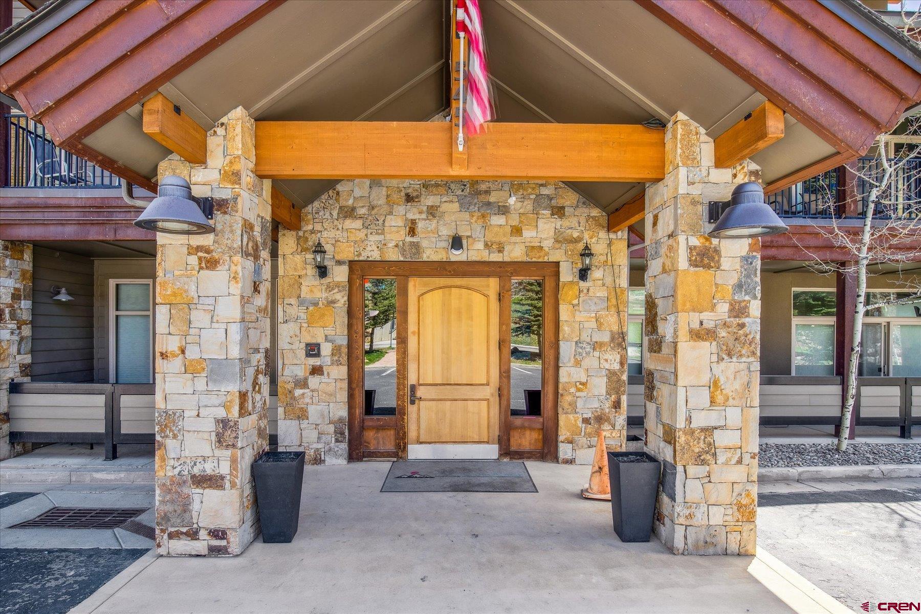 545 Skier Place, Unit 104 Durango, CO 81301 - Photo 2 of 45 a front view of a building with a entryway