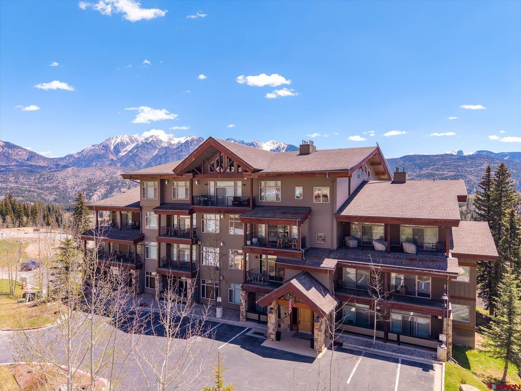 545 Skier Place, Unit 104 Durango, CO 81301 - Photo 21 of 45 a front view of a house with yard and balcony