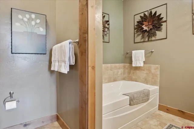 a bathroom with a tub and shower