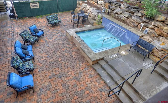 a view of living room with furniture and wooden floor
