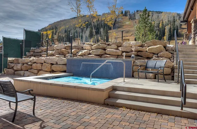 a view of house with outdoor seating