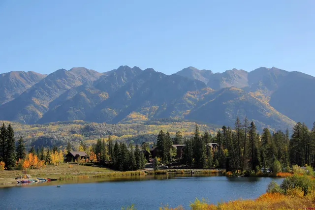 a view of a city with mountains in the background
