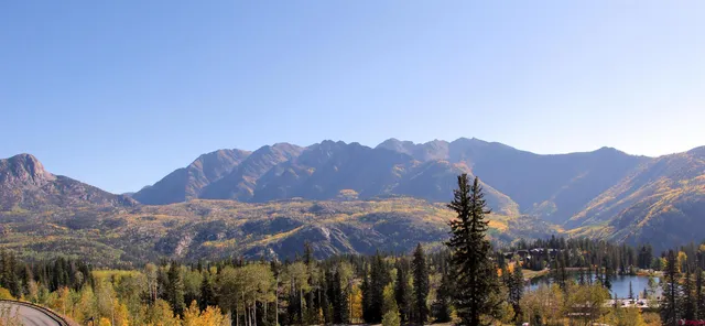a view of a city with mountains in the background