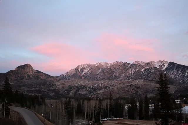 a view of a city with a mountain in the background