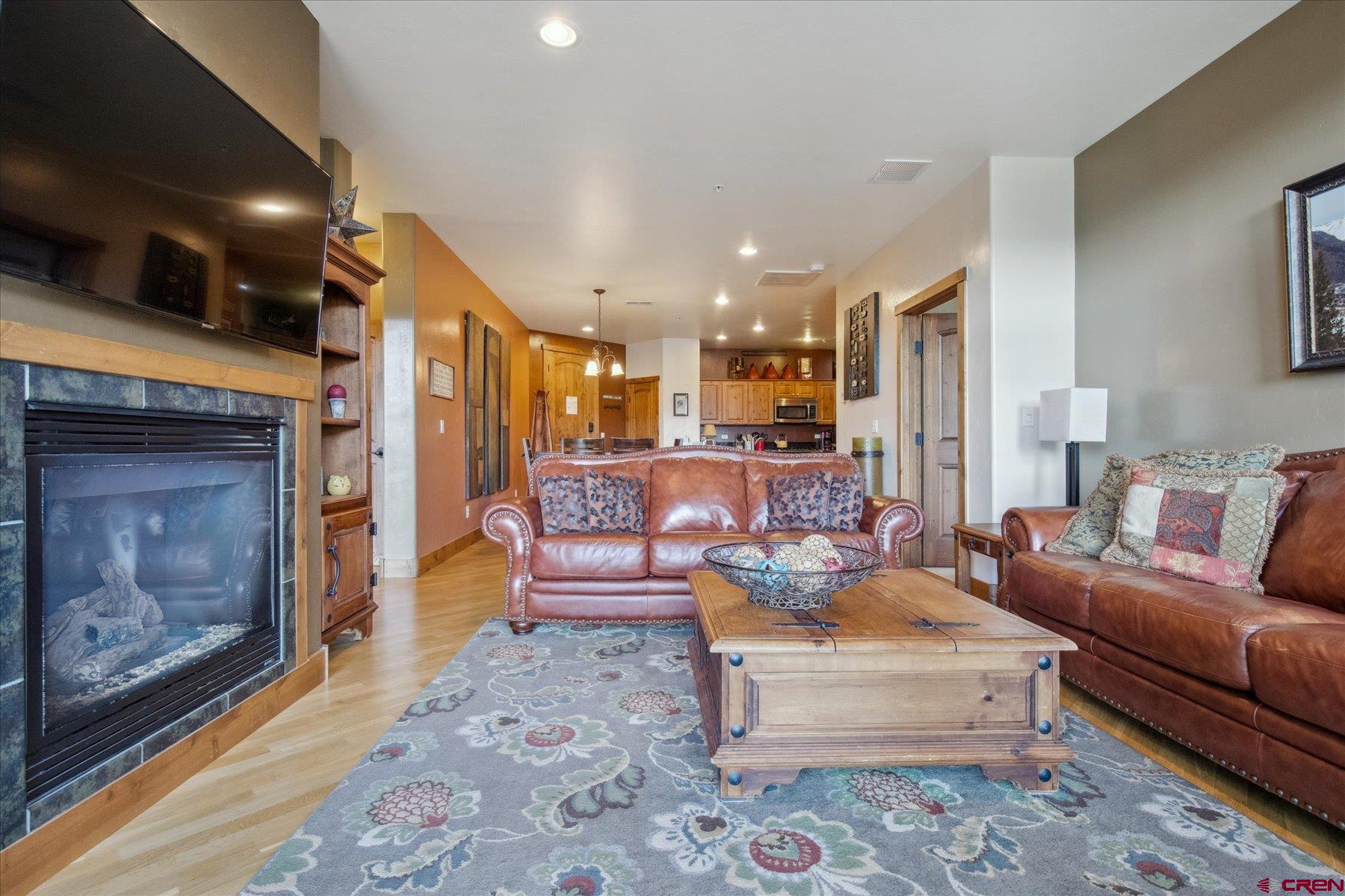 545 Skier Place, Unit 104 Durango, CO 81301 - Photo 8 of 45 a living room with furniture and a fireplace