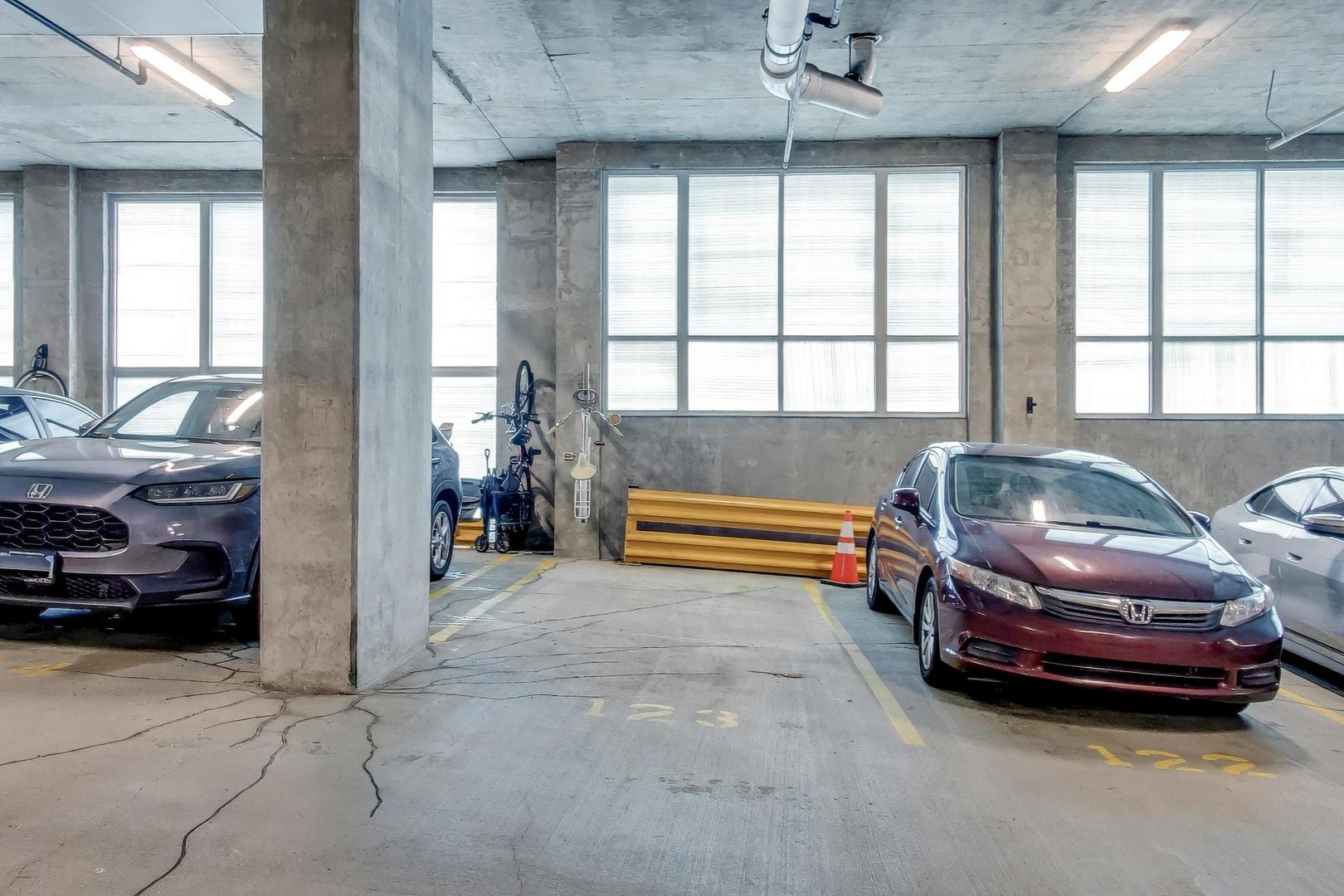 1600 South Indiana Avenue, Unit 1602 Chicago, IL 60616 - Photo 25 of 26 a living room with a bed and a large window