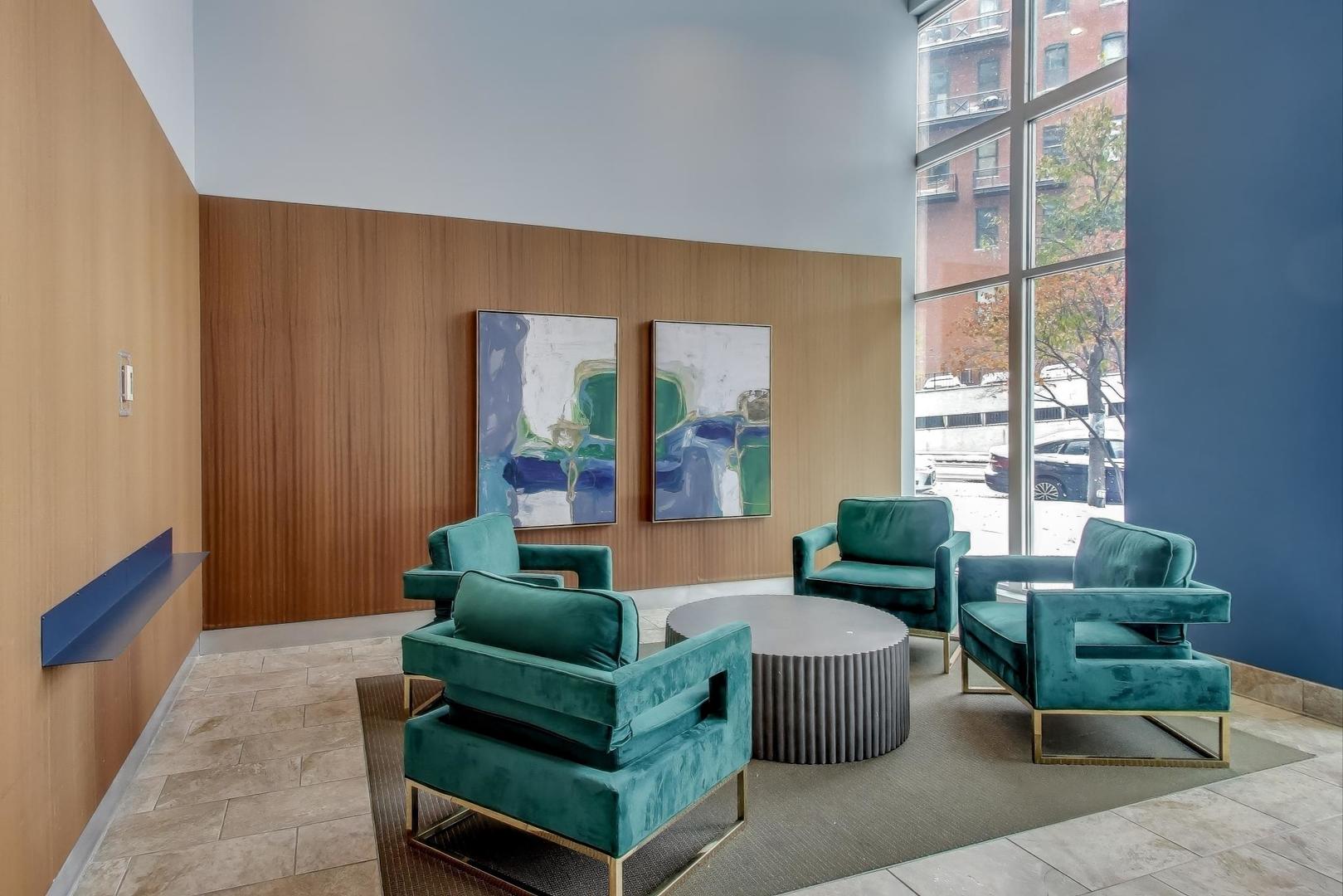 1600 South Indiana Avenue, Unit 1602 Chicago, IL 60616 - Photo 3 of 26 a living room with furniture and a large window