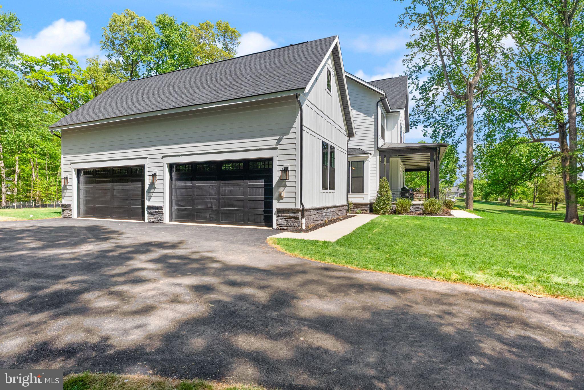 11800 Valley Road Fairfax, VA 22033 - Photo 12 of 76 a front view of a house with a yard and garage