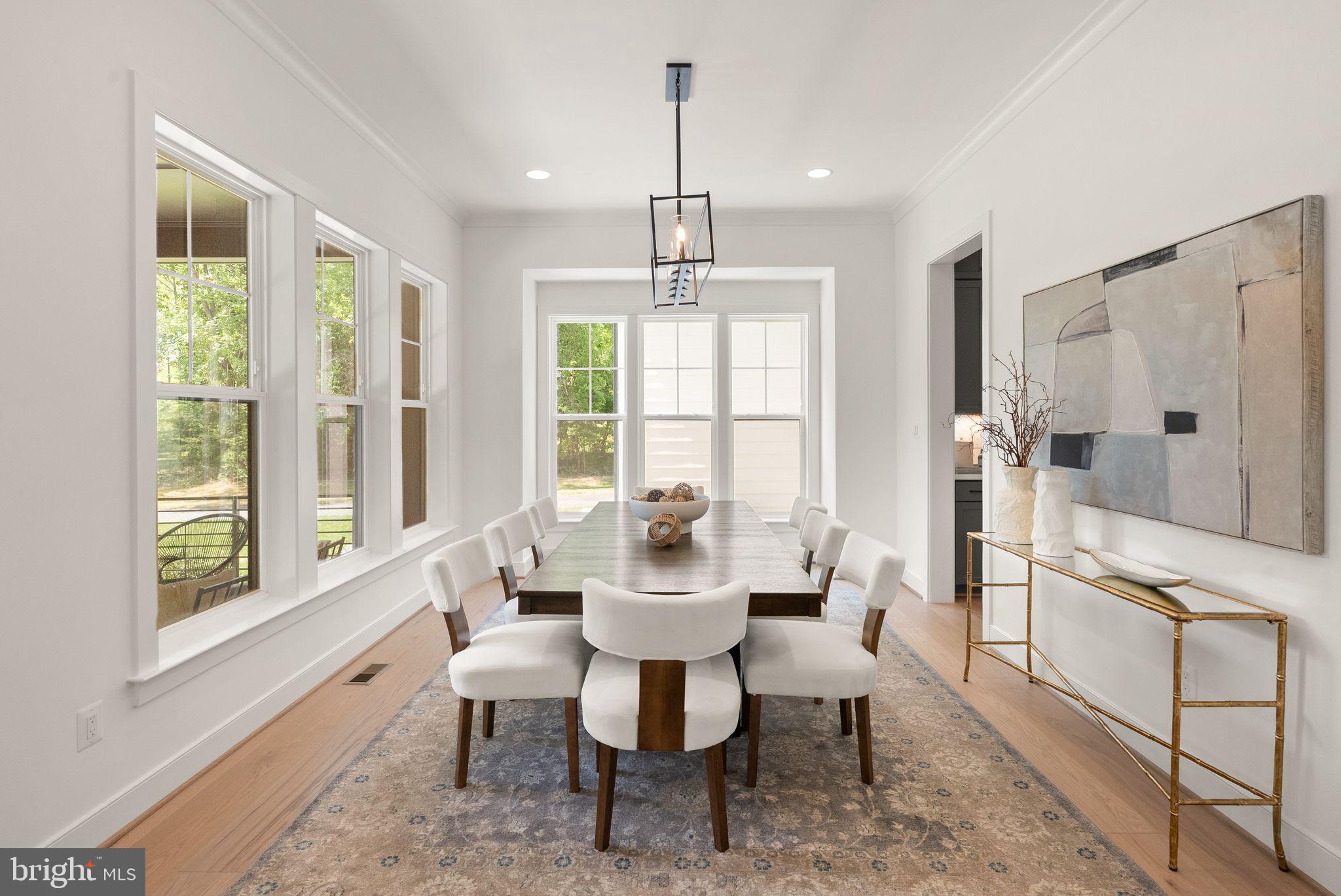 11800 Valley Road Fairfax, VA 22033 - Photo 25 of 76 a dining room with furniture a chandelier and wooden floor