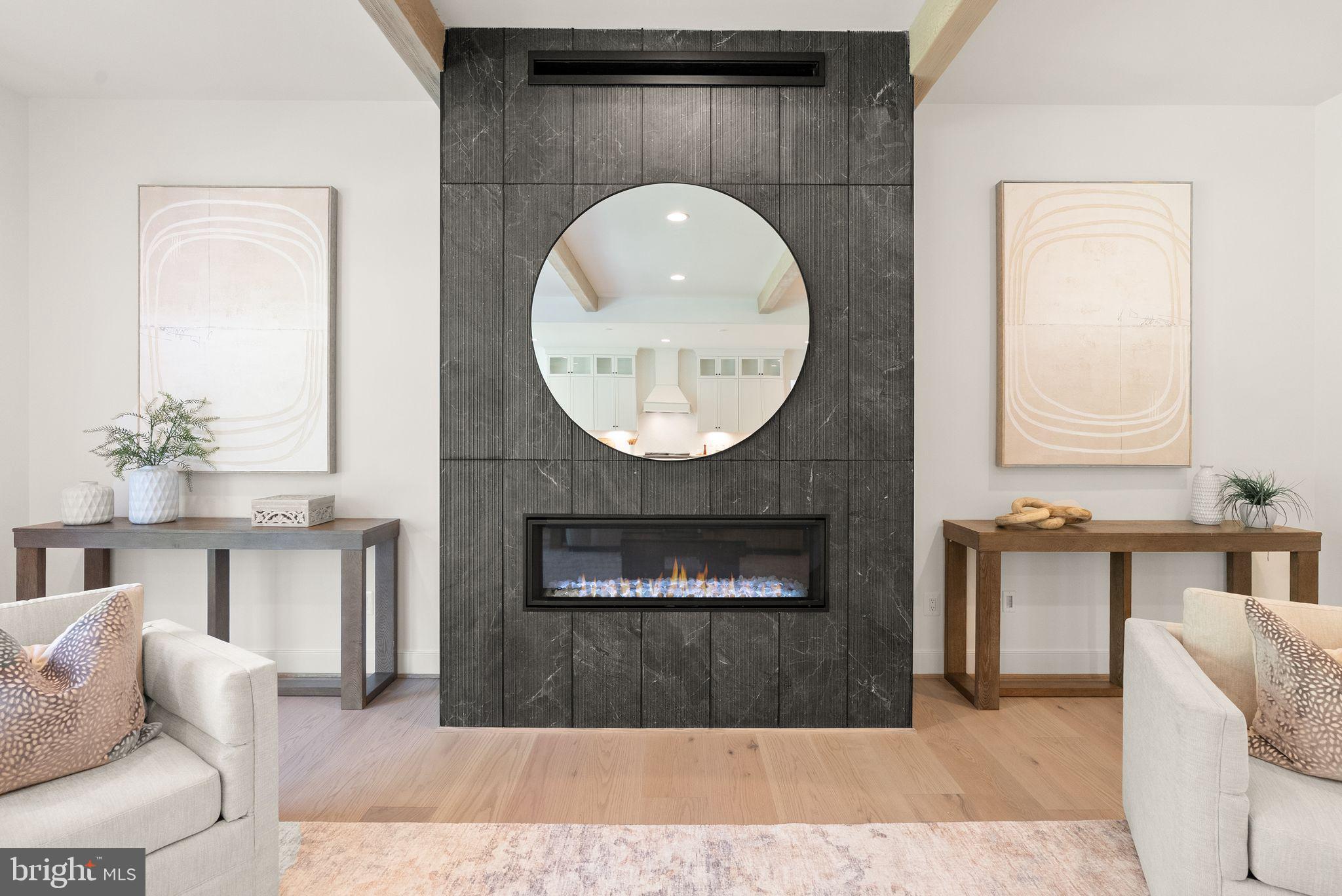 11800 Valley Road Fairfax, VA 22033 - Photo 32 of 76 a living room with furniture a mirror and a fireplace