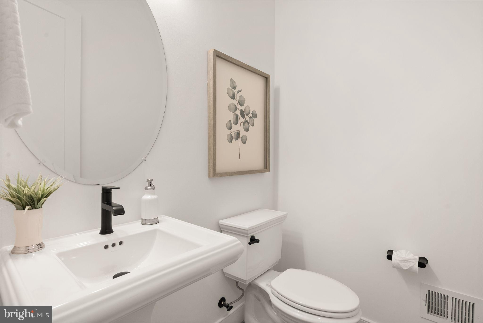 11800 Valley Road Fairfax, VA 22033 - Photo 38 of 76 a bathroom with a sink mirror and toilet