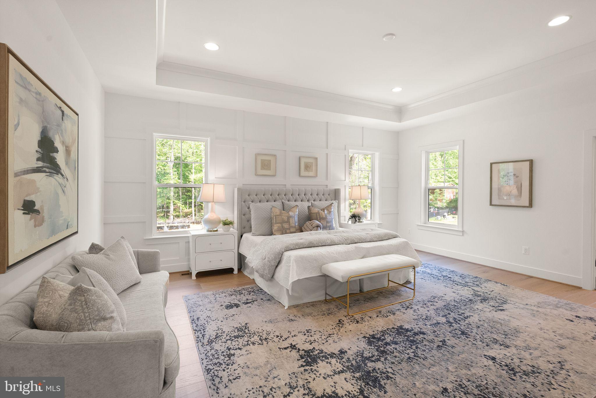 11800 Valley Road Fairfax, VA 22033 - Photo 42 of 76 a spacious bedroom with a bed and a couch