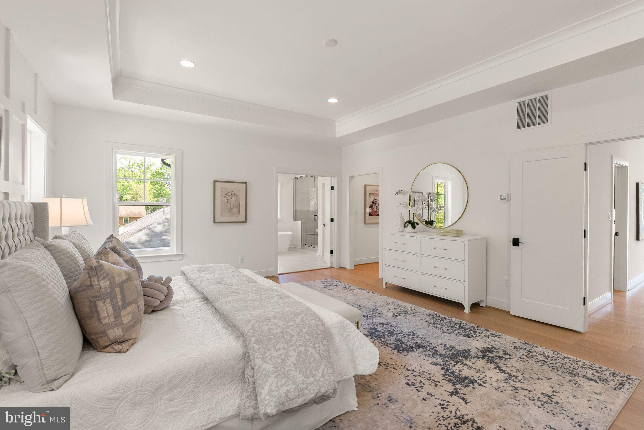 11800 Valley Road Fairfax, VA 22033 - Photo 43 of 76 a spacious bedroom with a large bed and wooden floor