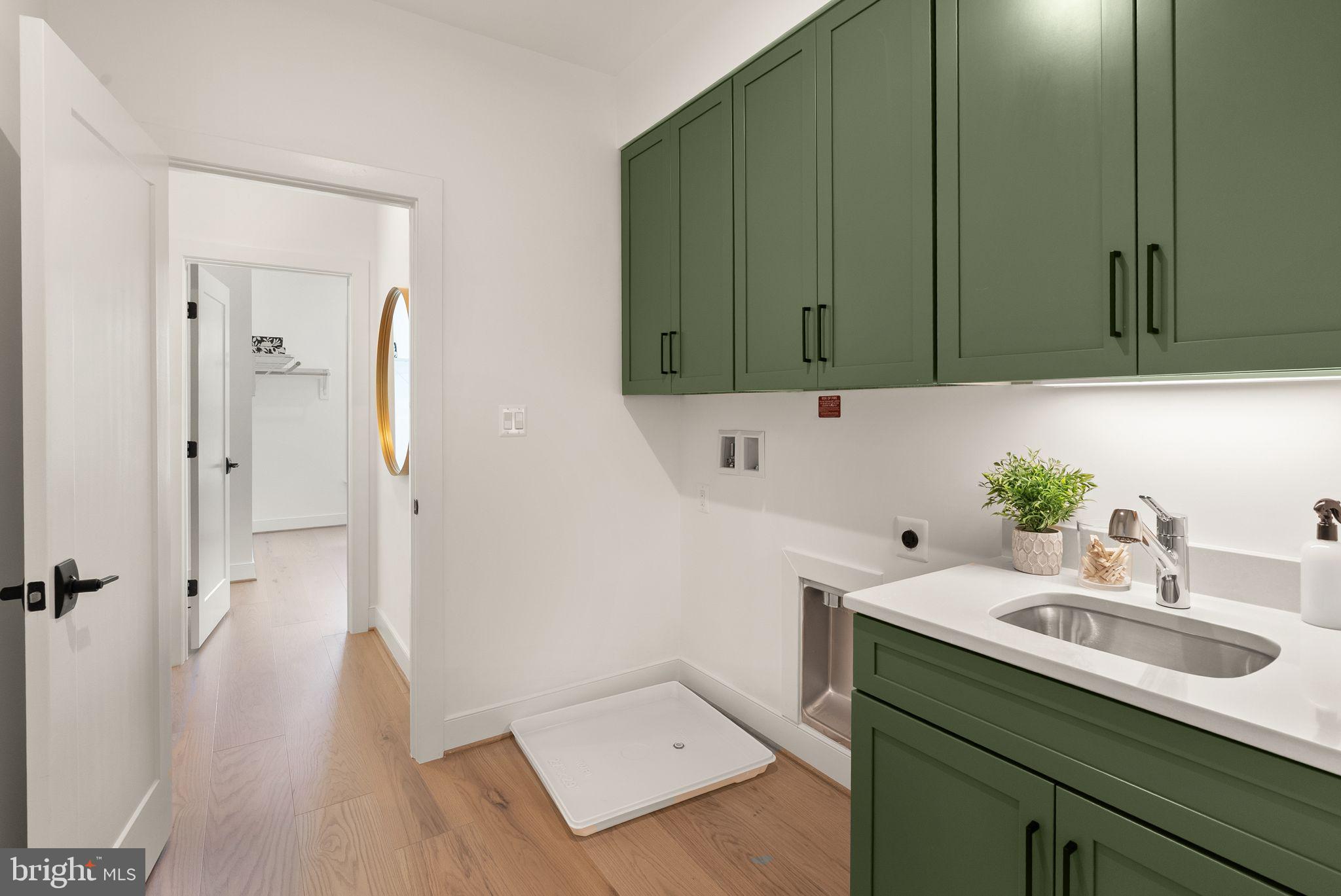 11800 Valley Road Fairfax, VA 22033 - Photo 59 of 76 a bathroom with a sink and a large mirror