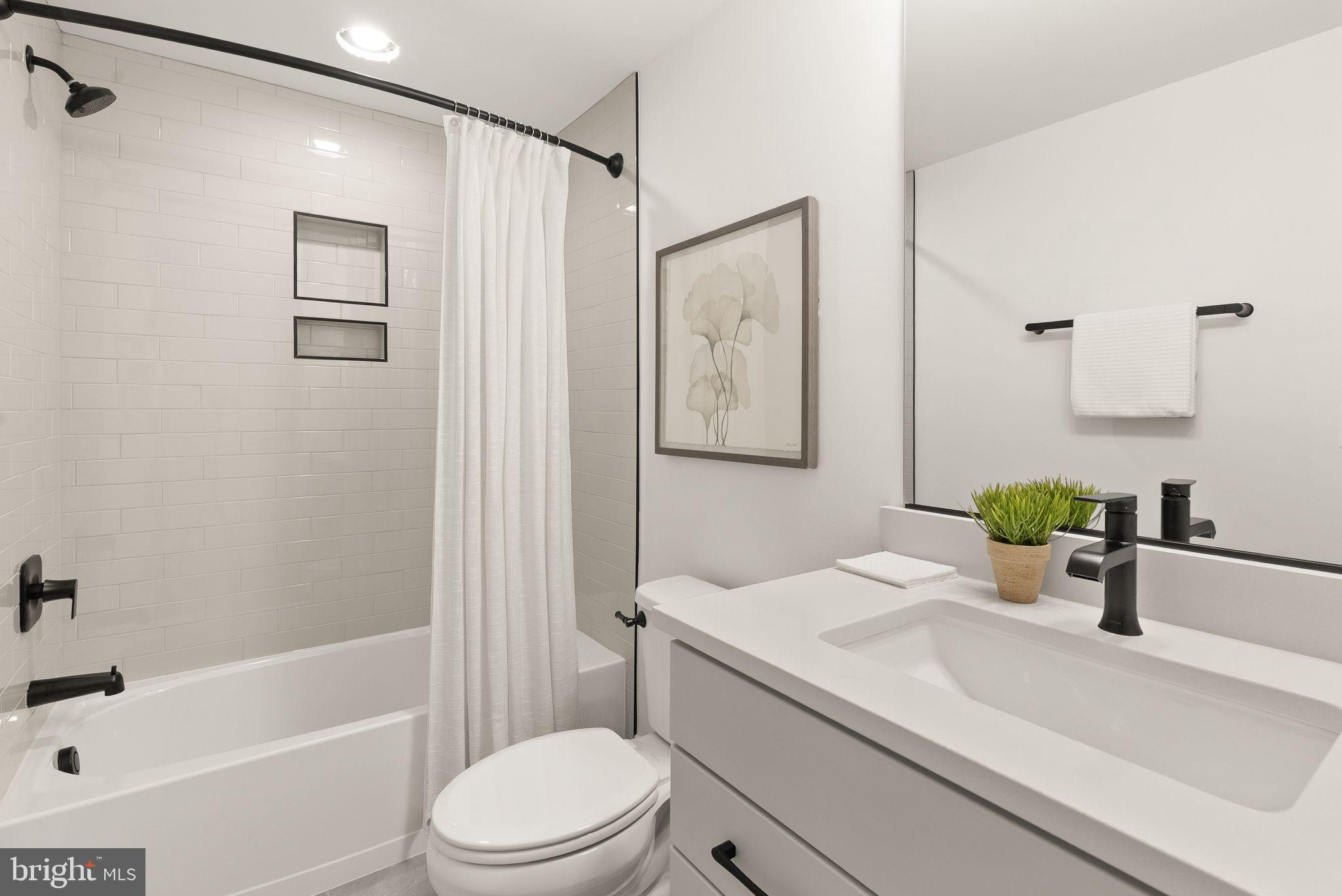 11800 Valley Road Fairfax, VA 22033 - Photo 73 of 76 a bathroom with a sink a toilet and shower