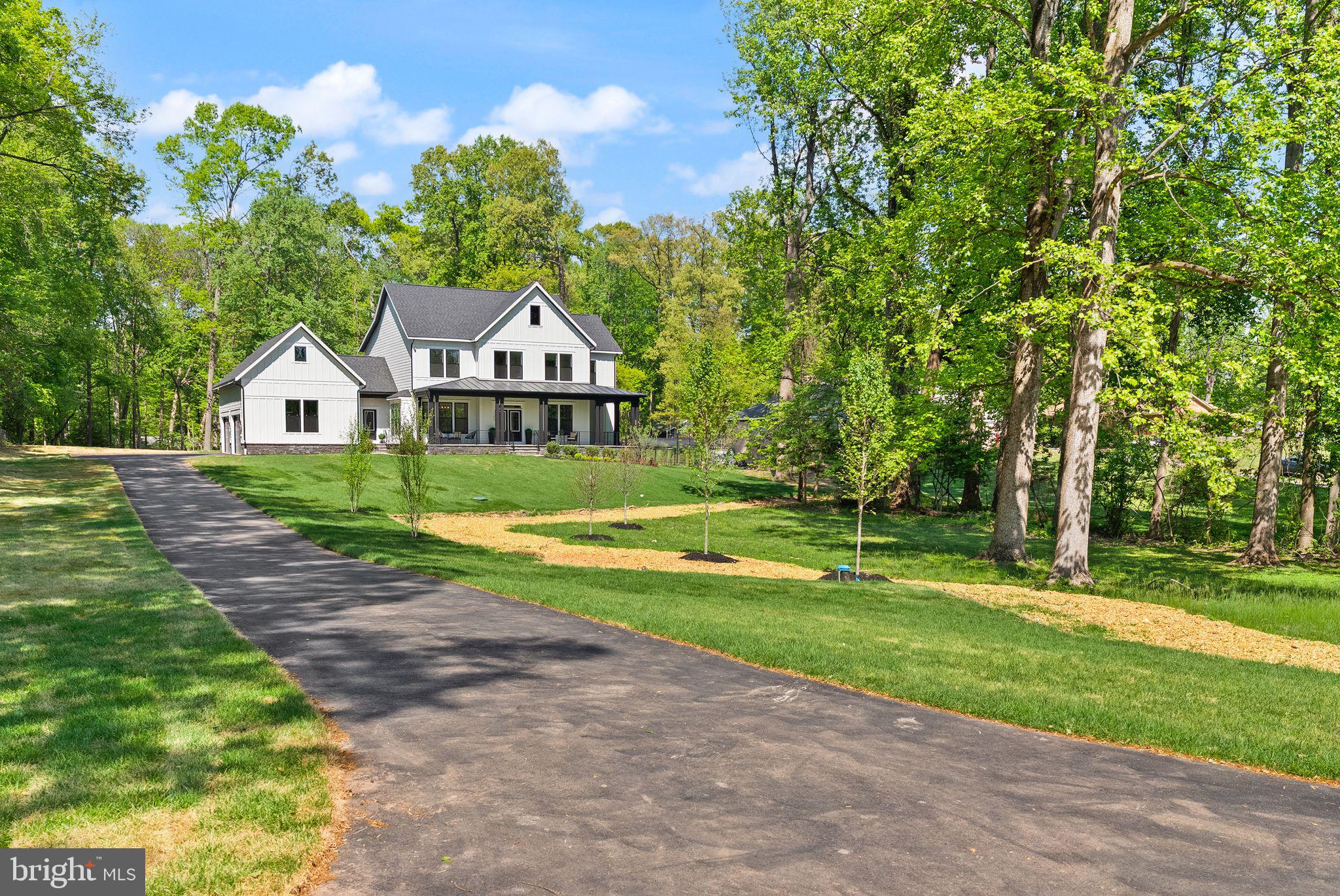 11800 Valley Road Fairfax, VA 22033 - Photo 8 of 76 a front view of a house with yard and green space
