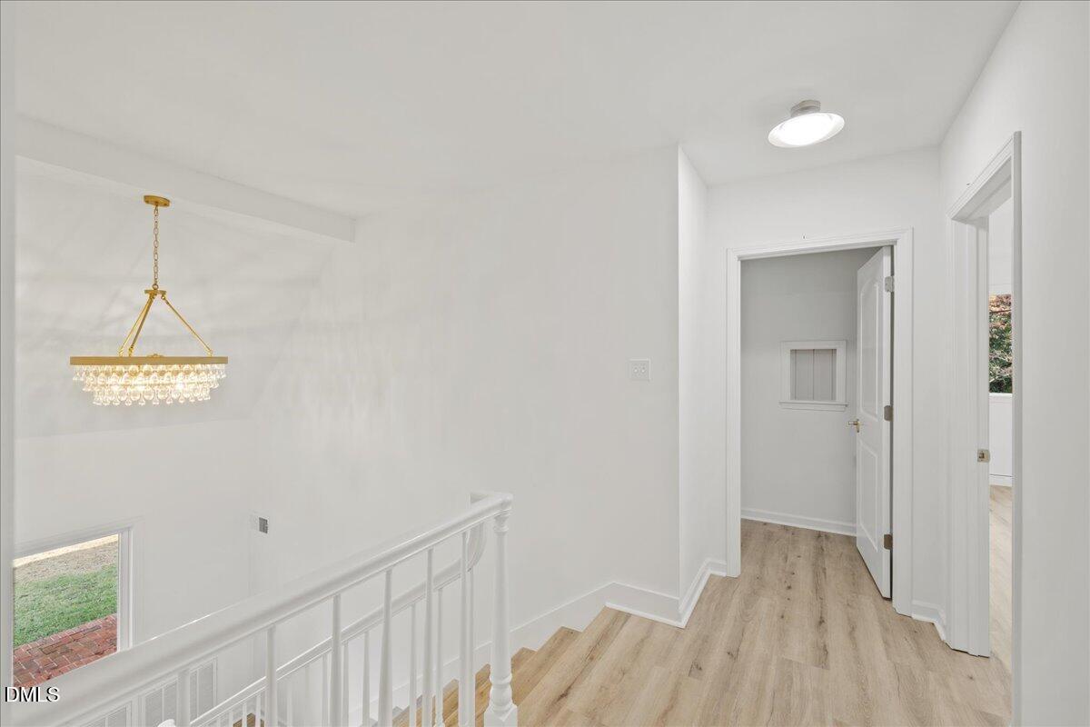 1615 Carbonton Road Sanford, NC 27330 - Photo 14 of 43 a view of a room with wooden floor and white walls