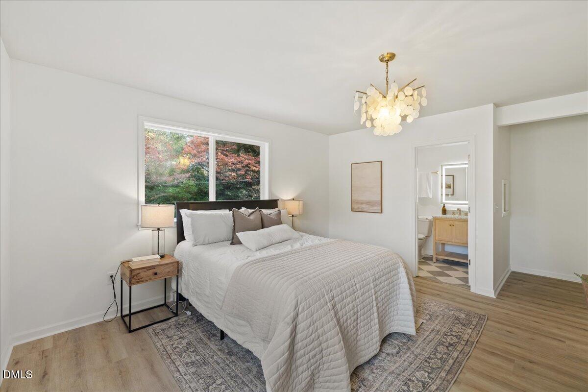 1615 Carbonton Road Sanford, NC 27330 - Photo 16 of 43 a bedroom with a bed mirror and window