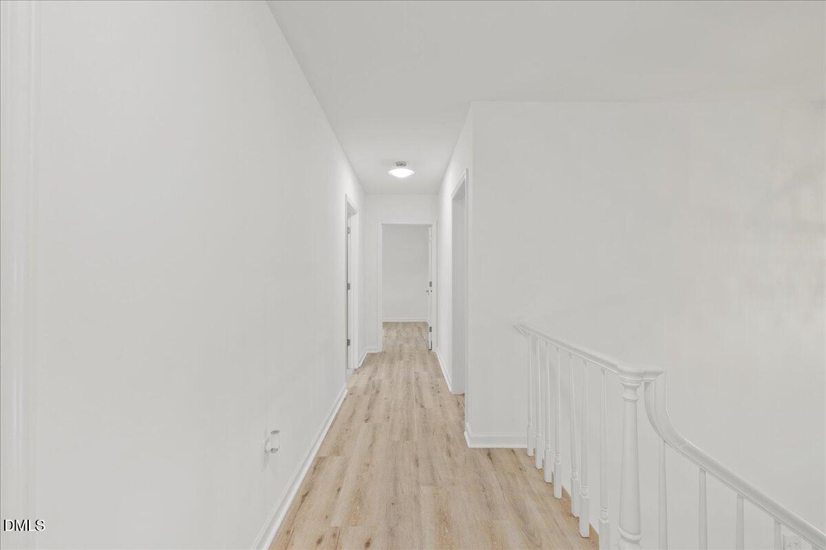 1615 Carbonton Road Sanford, NC 27330 - Photo 21 of 43 a view of a hallway with wooden floor