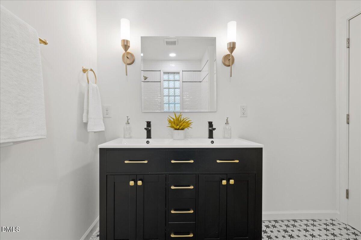 1615 Carbonton Road Sanford, NC 27330 - Photo 23 of 43 a bathroom with a sink and a mirror