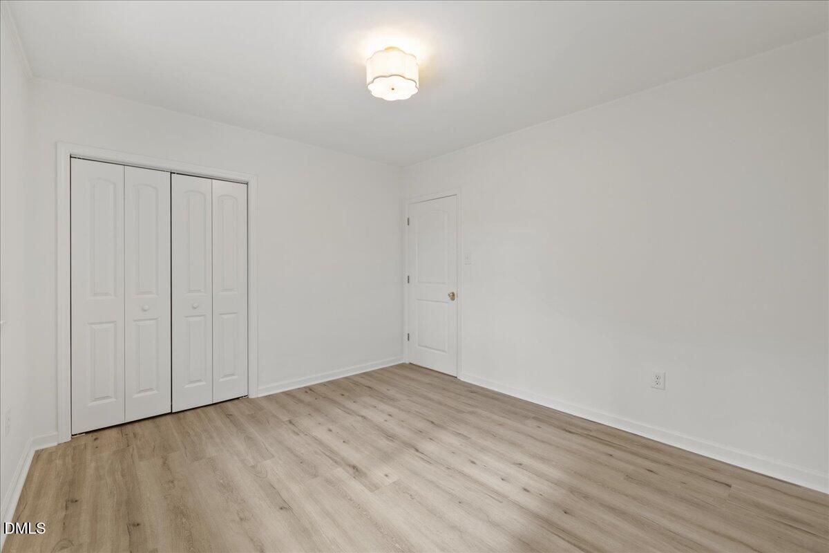1615 Carbonton Road Sanford, NC 27330 - Photo 25 of 43 a view of empty room with wooden floor