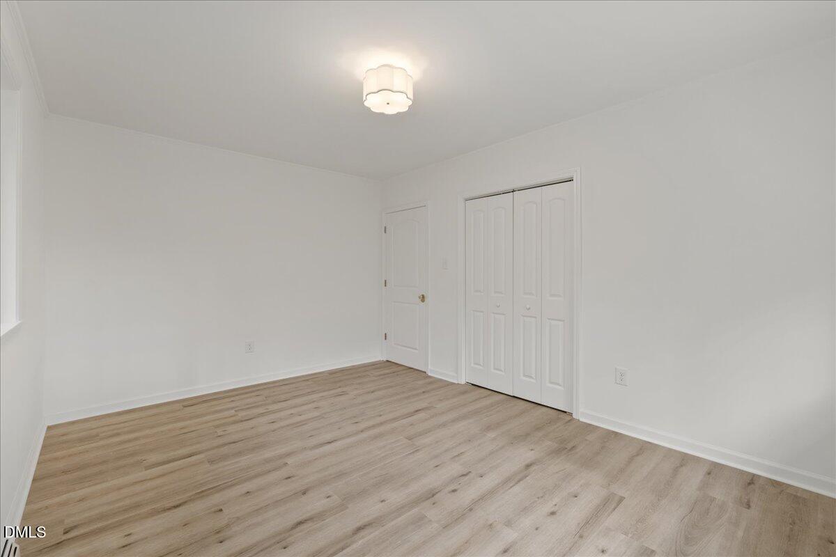 1615 Carbonton Road Sanford, NC 27330 - Photo 27 of 43 a view of empty room with wooden floor and fan