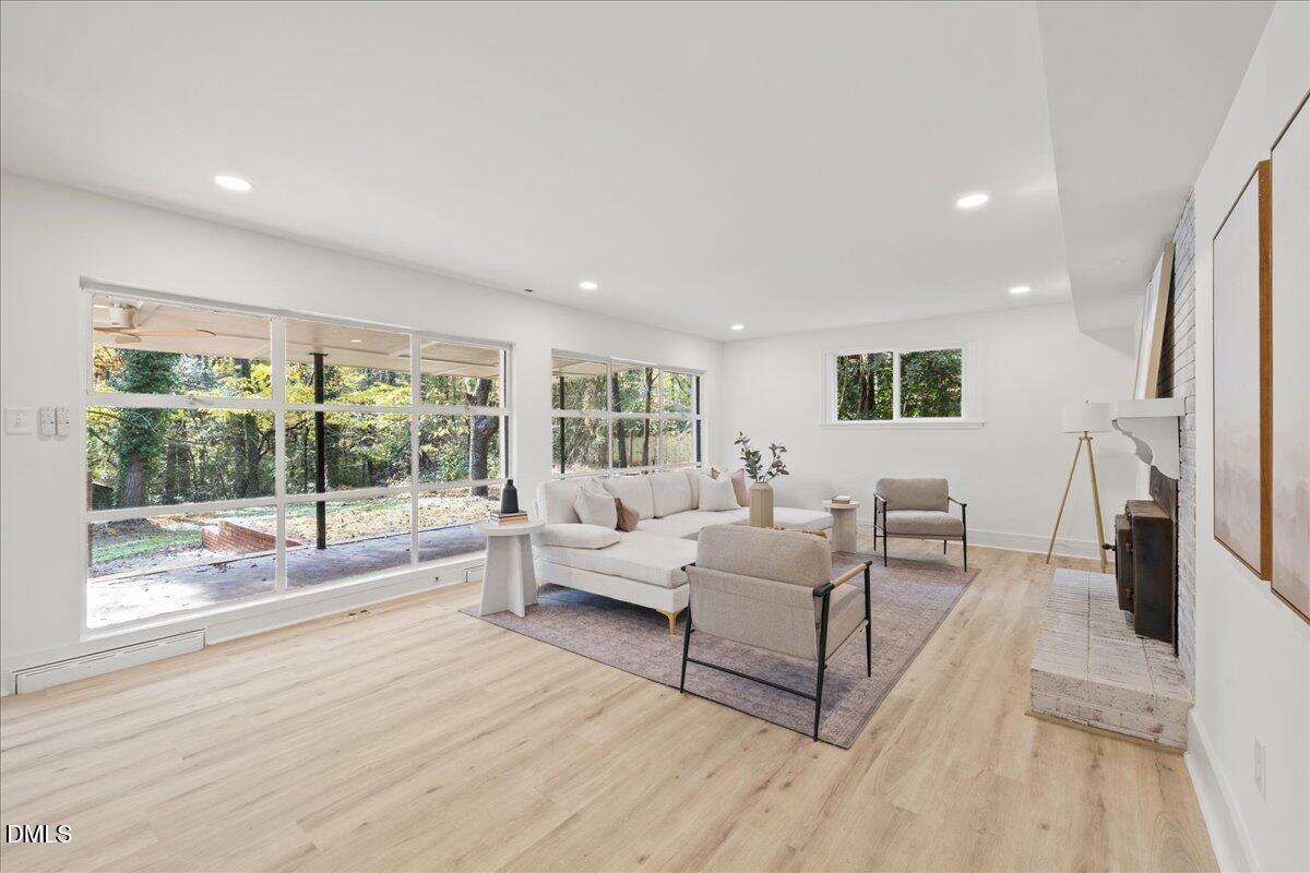1615 Carbonton Road Sanford, NC 27330 - Photo 2 of 43 a living room with furniture and a large window