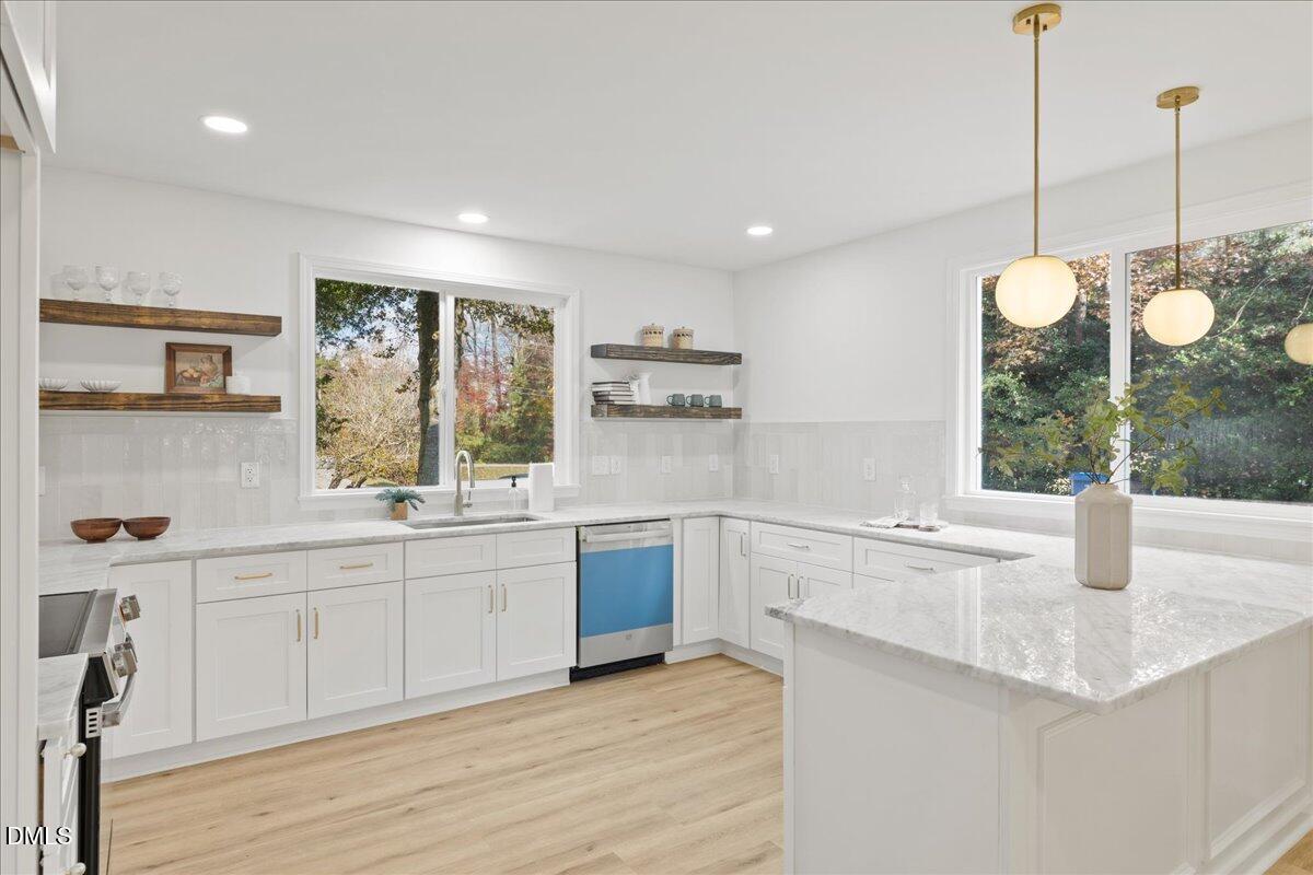 1615 Carbonton Road Sanford, NC 27330 - Photo 8 of 43 a kitchen with stainless steel appliances granite countertop a sink and window