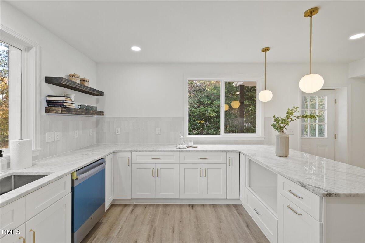 1615 Carbonton Road Sanford, NC 27330 - Photo 9 of 43 a large white kitchen with a window