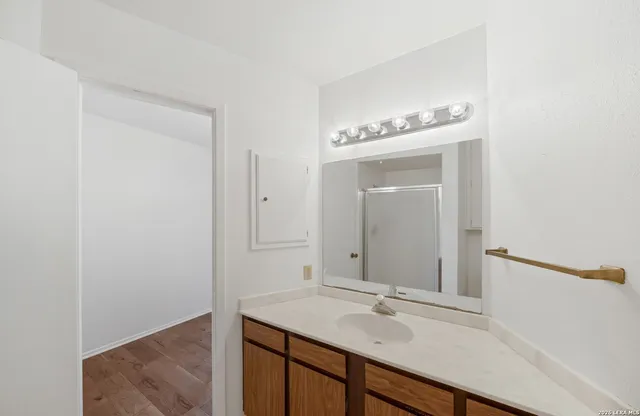 a bathroom with a sink and a mirror