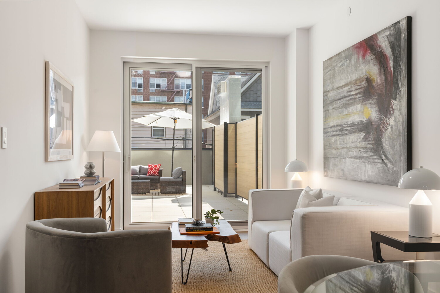 379 Ocean Parkway, Unit 3B Brooklyn, NY 11218 - Photo 11 of 23 a living room with furniture and a large window
