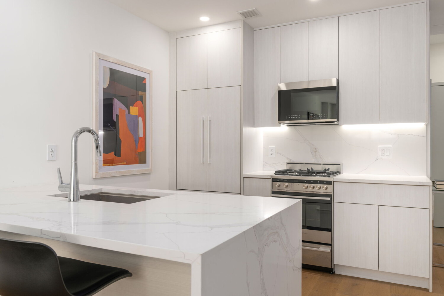 379 Ocean Parkway, Unit 3B Brooklyn, NY 11218 - Photo 12 of 23 a kitchen with stainless steel appliances granite countertop a sink and a stove