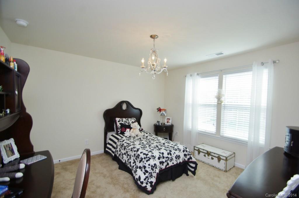 1601 Ridgehaven Road, Unit 245 Waxhaw, NC 28173 - Photo 14 of 24 a bedroom with a bed and a window