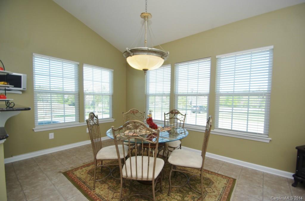 1601 Ridgehaven Road, Unit 245 Waxhaw, NC 28173 - Photo 8 of 24 a dining room with furniture and window