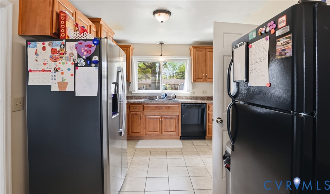 598 Old Wagner Road Petersburg, VA 23805 - Photo 11 of 43 Kitchen featuring wood cabinetry, stone-finish cou