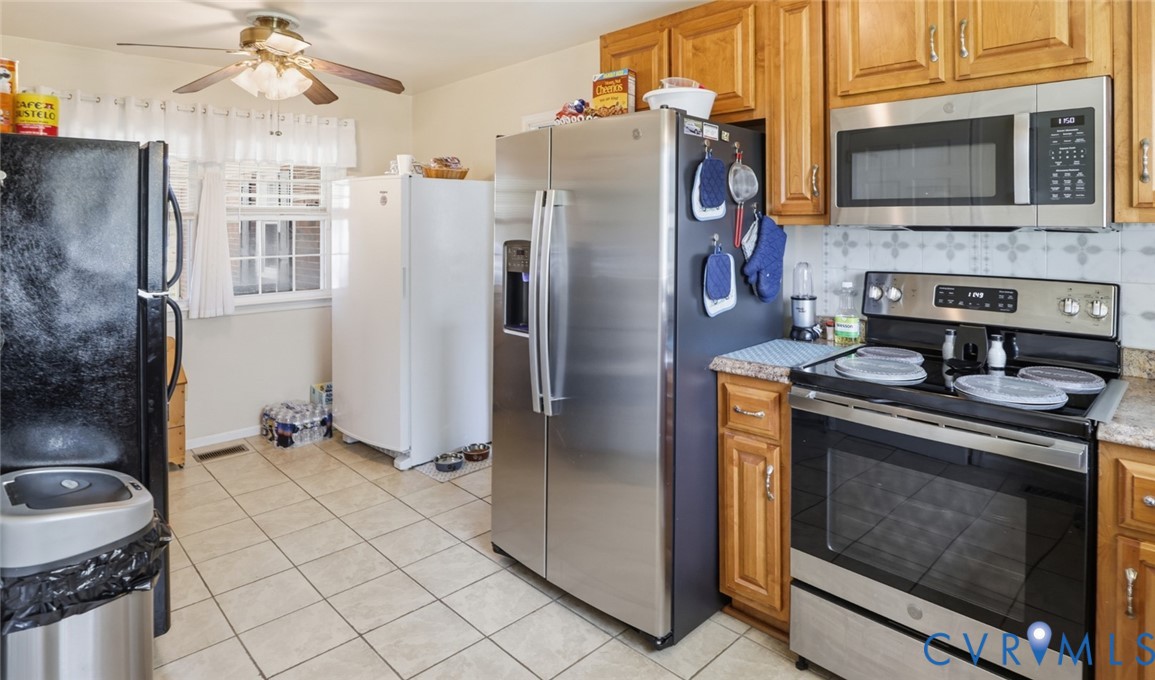 598 Old Wagner Road Petersburg, VA 23805 - Photo 12 of 43 Kitchen featuring wood cabinetry, a stainless stee