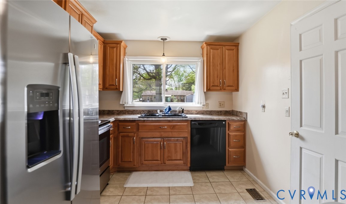 598 Old Wagner Road Petersburg, VA 23805 - Photo 13 of 43 Kitchen featuring wood cabinetry, stainless steel