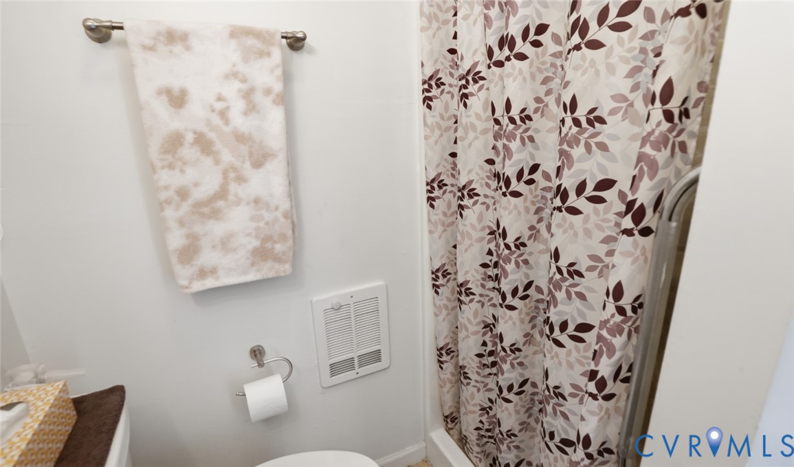 598 Old Wagner Road Petersburg, VA 23805 - Photo 17 of 43 Bathroom featuring a wall-mounted towel bar, toile