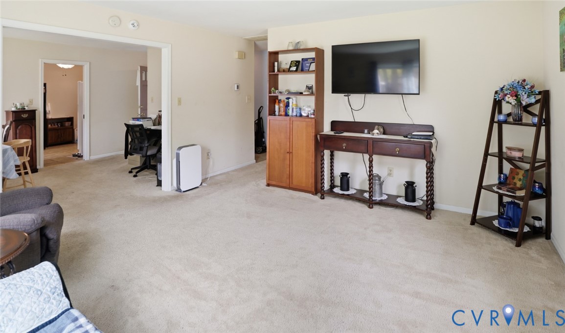 598 Old Wagner Road Petersburg, VA 23805 - Photo 21 of 43 Open living area featuring neutral carpeting and l